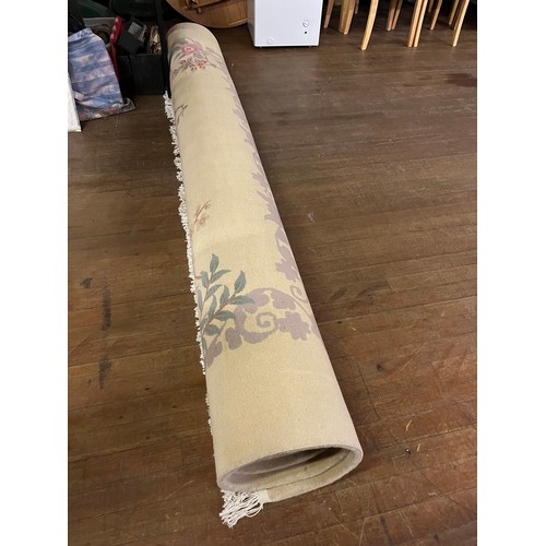 175 - A Large Chinese inspired Neutral wool rug. 
approx [370x273cm] 12ftx9ft