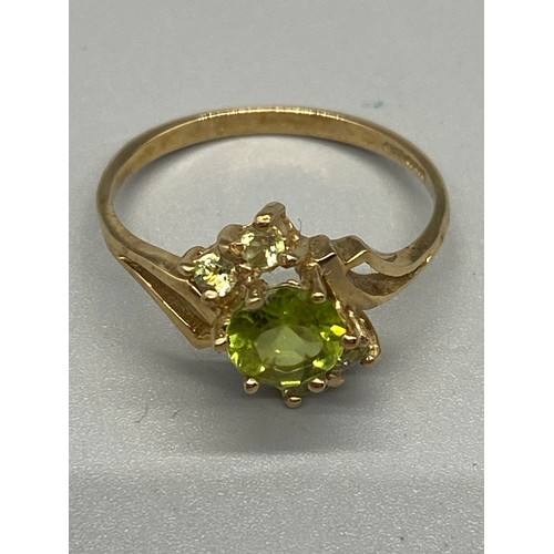 3 - 9ct yellow gold and peridot dress ring.