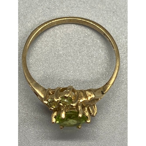 3 - 9ct yellow gold and peridot dress ring.