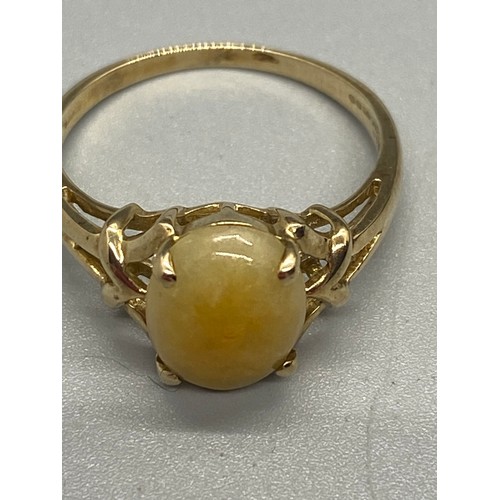 12 - 10k yellow gold and butterscotch amber ring.