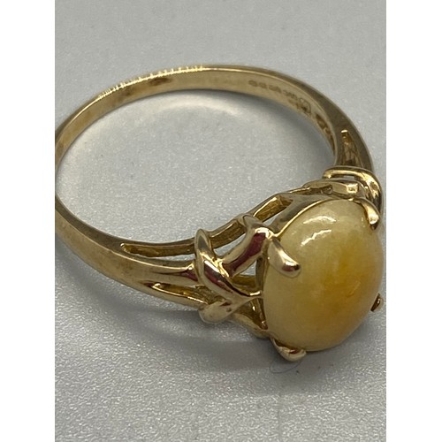 12 - 10k yellow gold and butterscotch amber ring.