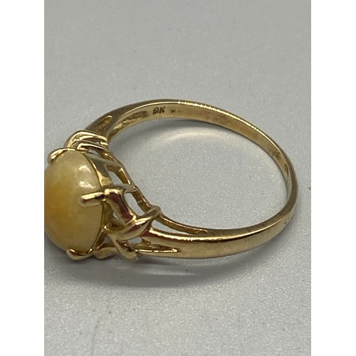 12 - 10k yellow gold and butterscotch amber ring.