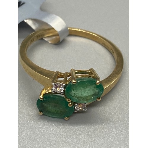 13 - 10k yellow gold and Peridot and white stone ring.