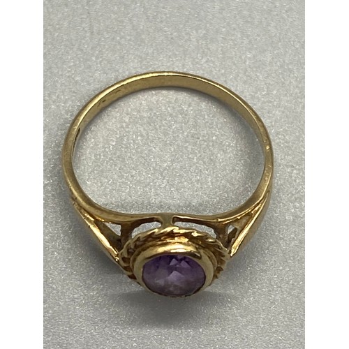 15 - 9ct yellow gold and amethyst ring.