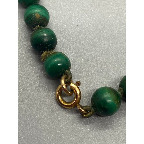 112 - Vintage Malachite beaded necklace with 9ct gold clasp and catch.