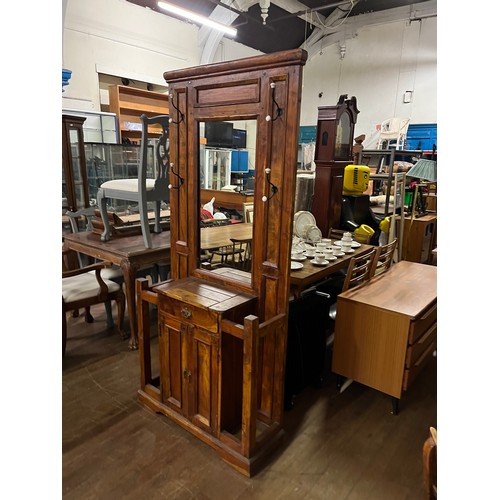 73 - Large solid Mexican pine hall stand to include 2 door storage cabinet & umbrella stand. 
(194x88x30c... 