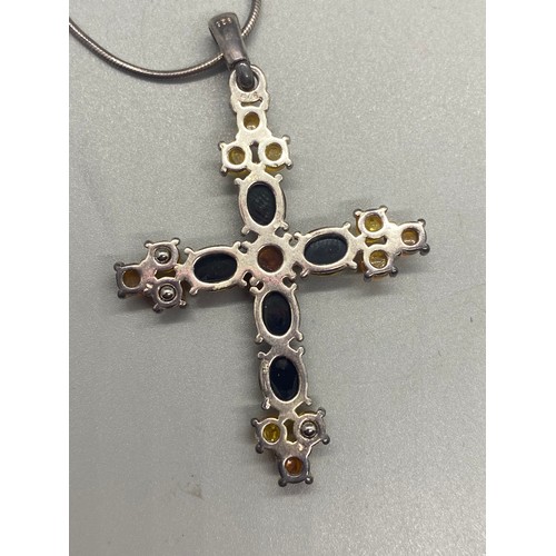 105 - Silver and amber cross pendant and chain along with 2 silver and amber pendants