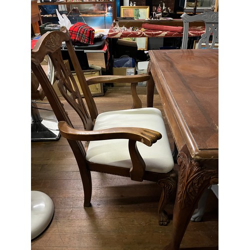 207 - Chinese highly carved extending dining table with 6 chairs to include 2 carvers.