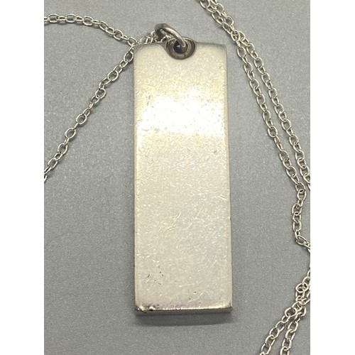 255 - Silver ingot pendant and silver chain. 32.14g