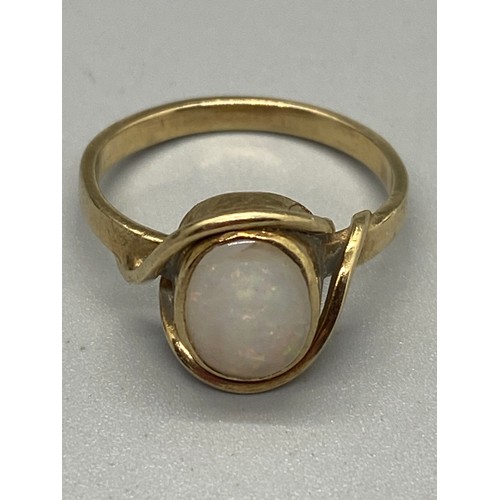 265 - Gold and fire opal ring. testing 9ct.