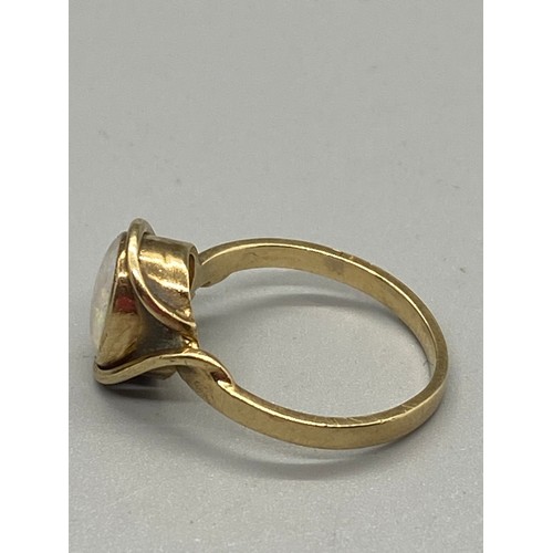 265 - Gold and fire opal ring. testing 9ct.