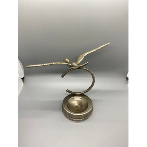 269 - Heavy desktop art deco silvered brass/bronze flying swallow figure on base.