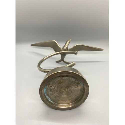 269 - Heavy desktop art deco silvered brass/bronze flying swallow figure on base.