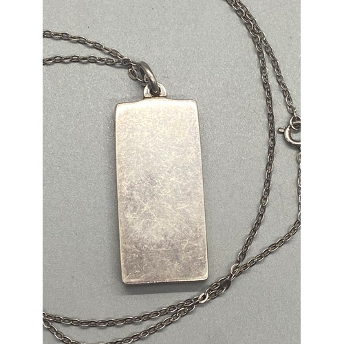 282 - Silver ingot pendant and silver chain. 33.74g