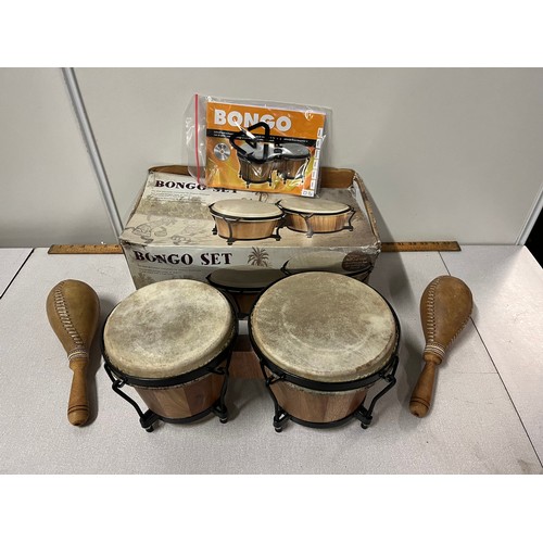 64 - Boxed set of bongo drums along with 2 arts & crafts shaker/rattle instruments.