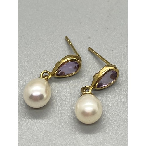 127 - 9ct gold, Amethyst and diamond pendant necklace along with 9ct gold and amethyst pearl drop earrings... 