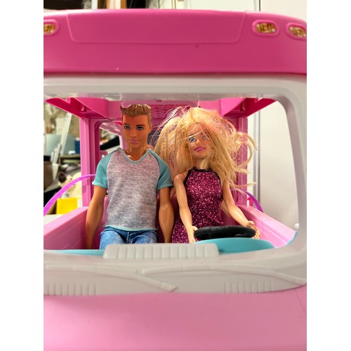 324 - Barbie dream camper with barbie and ken dolls and accessories.
56cm l