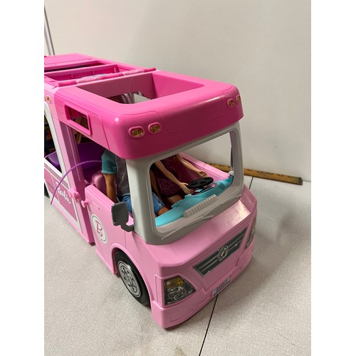 324 - Barbie dream camper with barbie and ken dolls and accessories.
56cm l