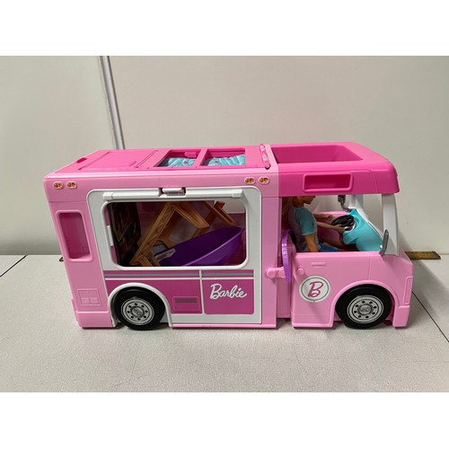 324 - Barbie dream camper with barbie and ken dolls and accessories.
56cm l