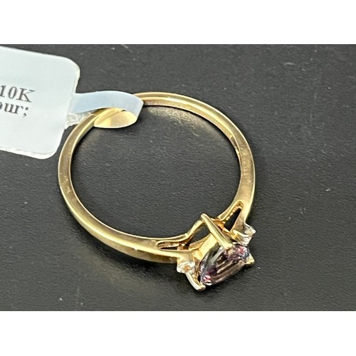 6 - 10k yellow gold and tanzanite solitaire ring.