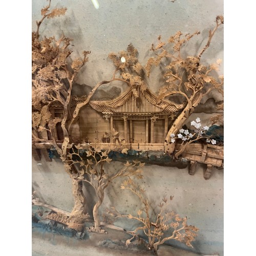 498 - framed diorama in carved wood depicting house on a lake 
65x 45cm