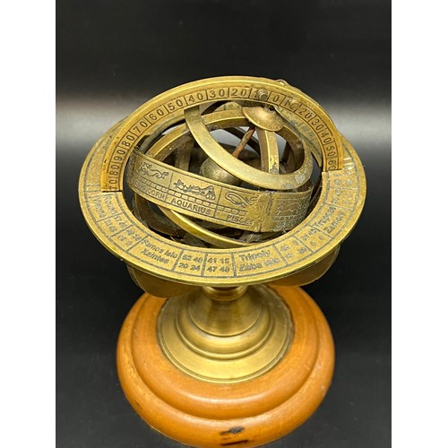 164 - Vintage Armillary brass desktop globe on wooden base.
14cm h