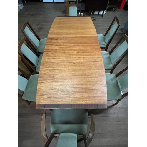 215 - McIntosh teak & rosewood extending table along with 8 G Plan rosewood chairs to include 2 carvers.