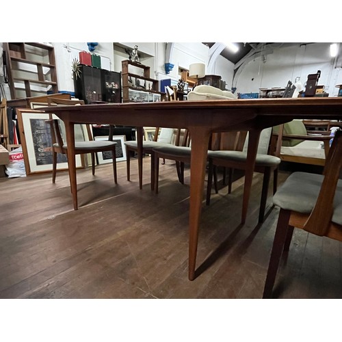 215 - McIntosh teak & rosewood extending table along with 8 G Plan rosewood chairs to include 2 carvers.