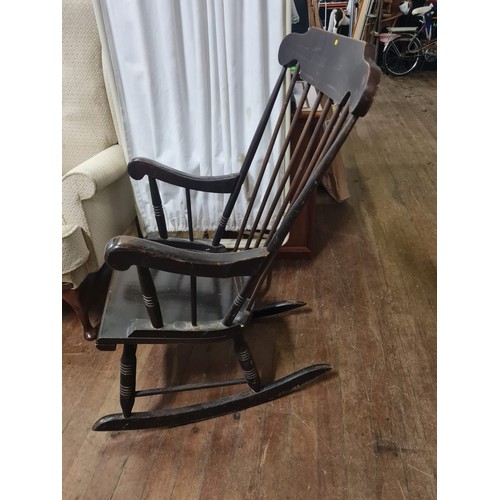 218 - Vintage dark wood rocking chair.