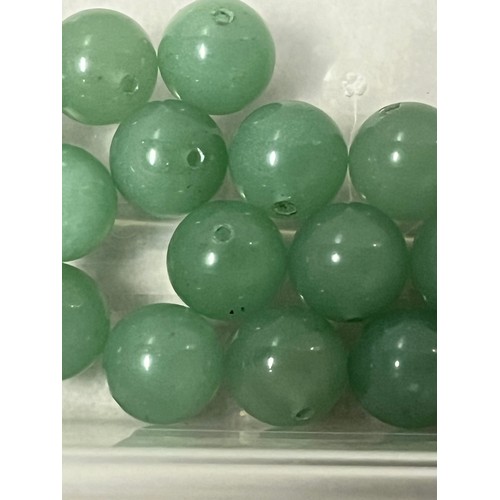 247 - tub of jade beads