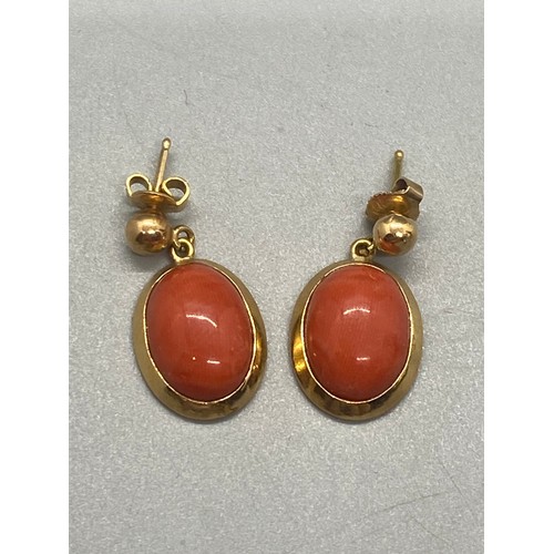 263 - Pair of 18ct gold and coral earrings. 5.26g