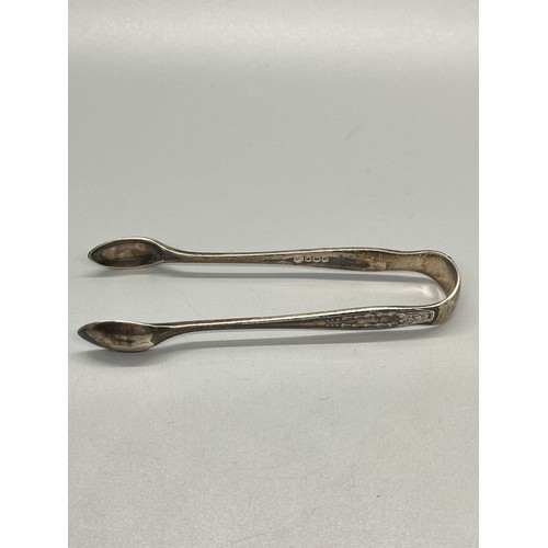 57 - 2 hallmarked silver spoons and silver sugar tongs.