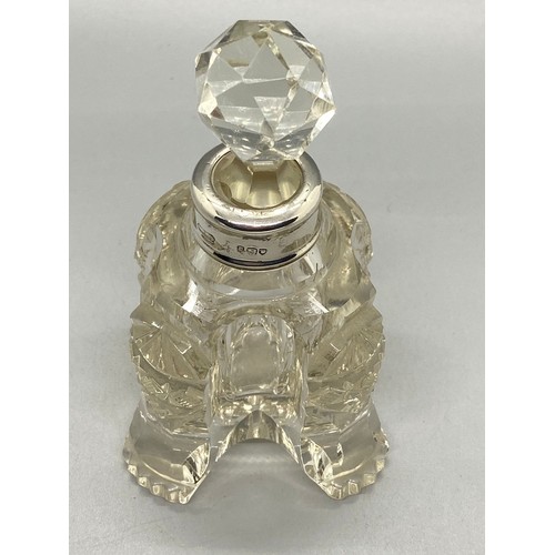 117 - Vintage cut glass scent bottle with silver collar.