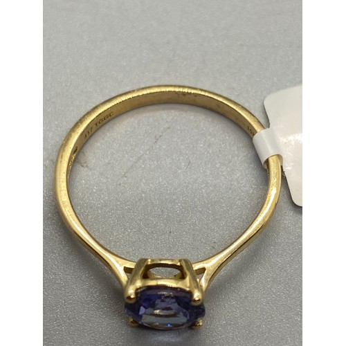 5 - 10k yellow gold and tanzanite solitaire ring.