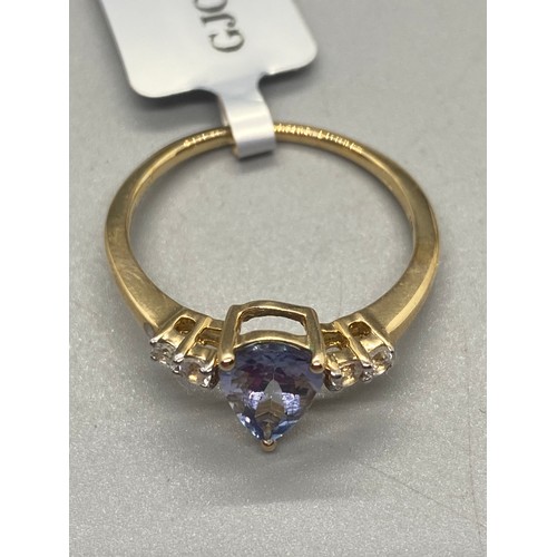 9 - 10k yellow gold, tanzanite and diamond ring.