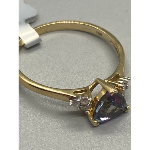 11 - 10k yellow gold, tanzanite and diamond ring.