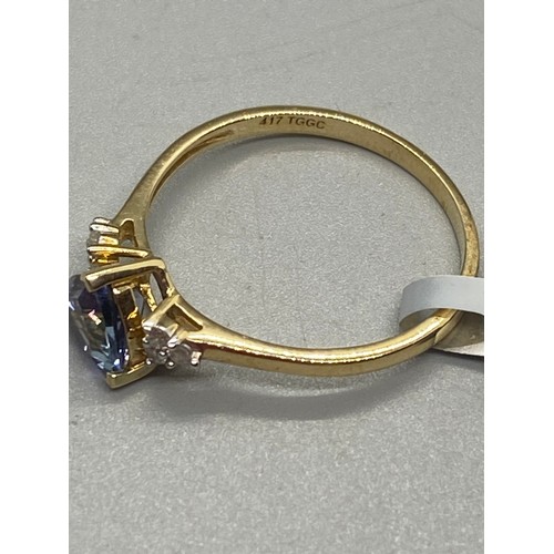 11 - 10k yellow gold, tanzanite and diamond ring.