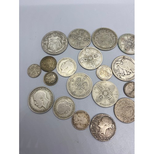 139 - Collection of silver coins to include 1943 liberty half dollar, 1921 half crown and 1920's florin et... 