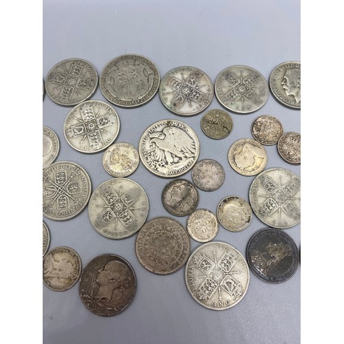 139 - Collection of silver coins to include 1943 liberty half dollar, 1921 half crown and 1920's florin et... 