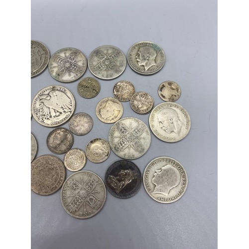 139 - Collection of silver coins to include 1943 liberty half dollar, 1921 half crown and 1920's florin et... 