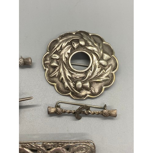 156 - 4 silver brooches and 1 other plated Victorian thistle design brooch, Glasgow silver ornate celtic d... 