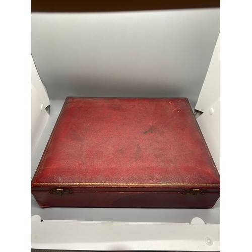 167 - Antique red leather canteen chest contains Sheffield silver handled forks and knives.