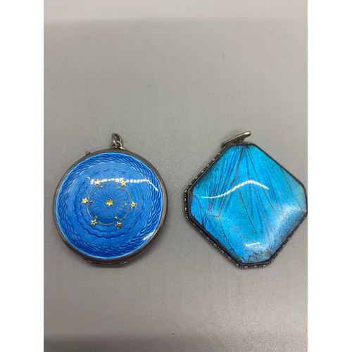 238 - Silver and blue enamel locket pendant and silver and blue butterfly pendant.