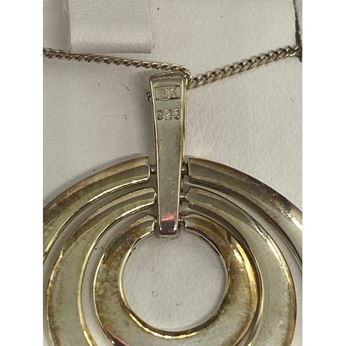 18 - 925 silver circle pendent and chain.