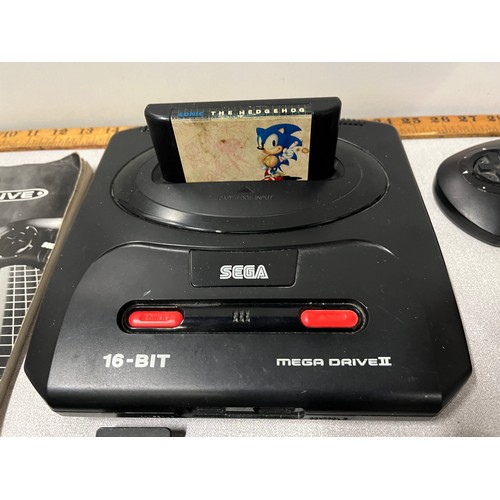 304 - Sega Mega Drive II 16-BIT system along with controllers & 5 games.