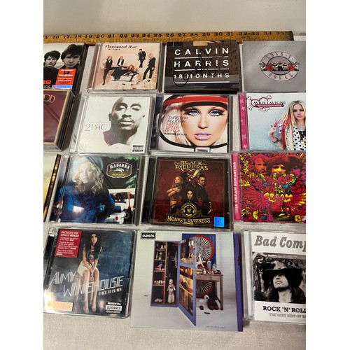 305 - Selection of CD's to include The Killers, Amy Winehouse & Calvin Harris 18 Months signed by Calvin H... 