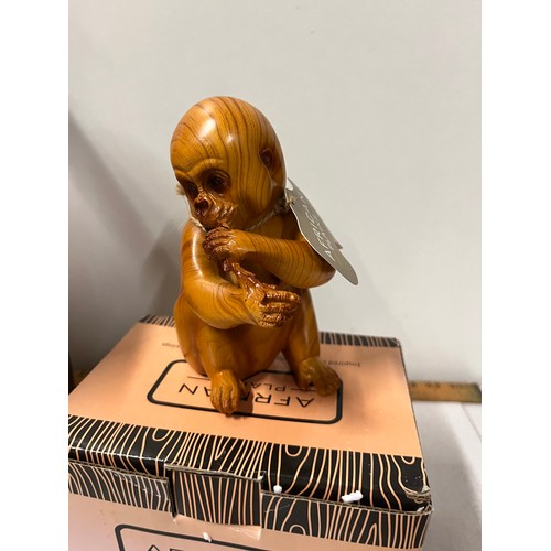 84 - 2 boxed African Plains animal figures - eagle and baby gorilla.
eagle 26cm h