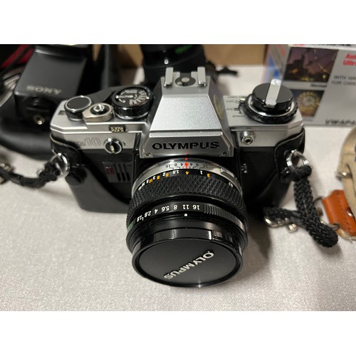 289 - olympus camera along with lenses to include vivitar & sony etc