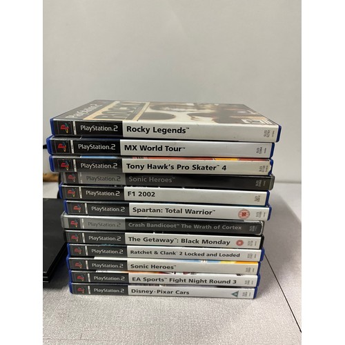 294 - playstation 2 with 26 games . no power cable