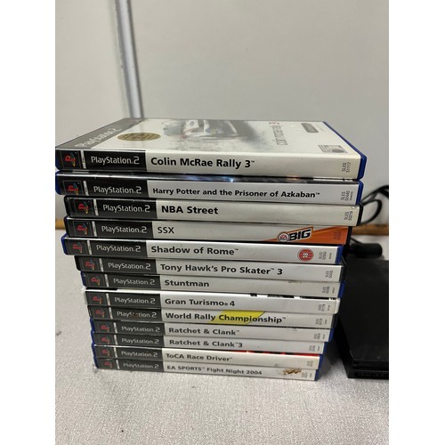 294 - playstation 2 with 26 games . no power cable